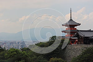 View of SanjÃÂ«nodÃÂ pagoda highest pagoda in Japan with 31 m. high with Kyoto city on background, Kiyomizu-dera temple, Kyoto. photo